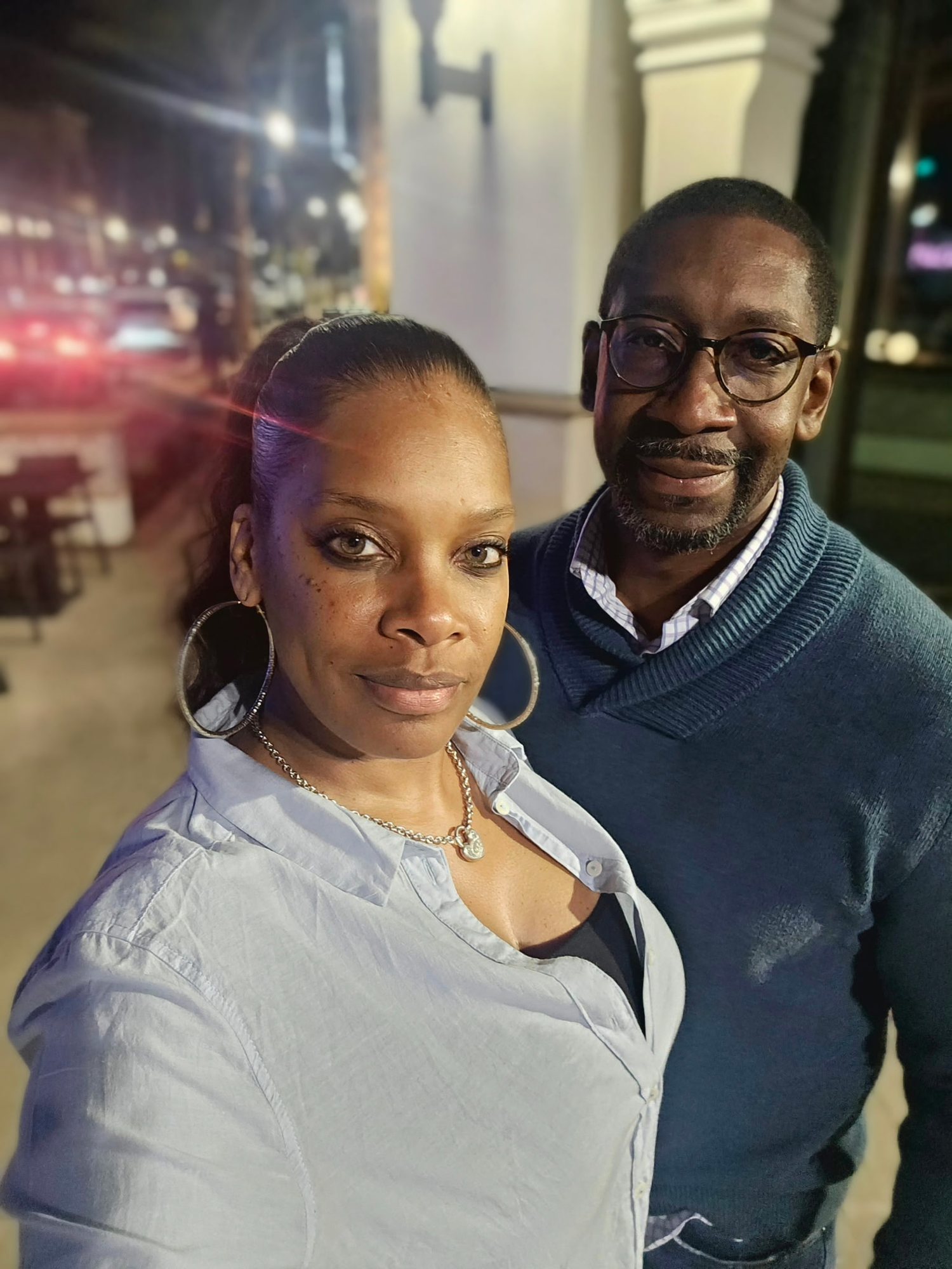 The couple close together on an evening out.